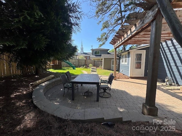 1019 Valley St, Kannapolis, NC 28081 - view of patio / terrace with outdoor dining area, a playground, and a pergola