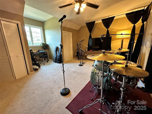 game room featuring carpet, ceiling fan, and lofted ceiling