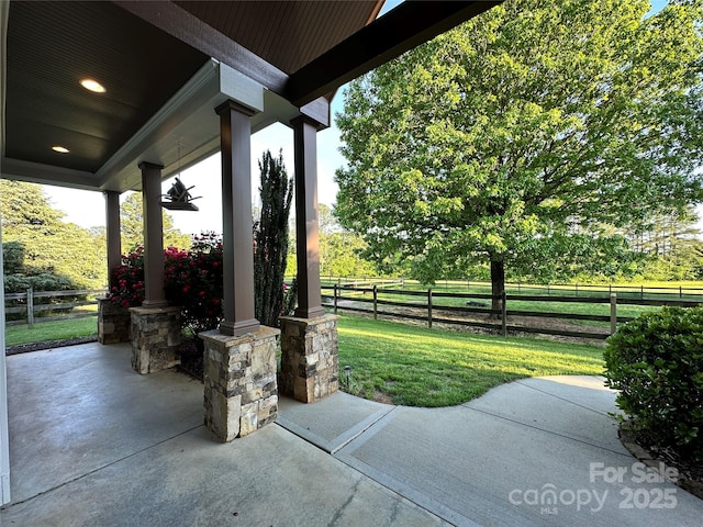 view of patio with fence and covered porch