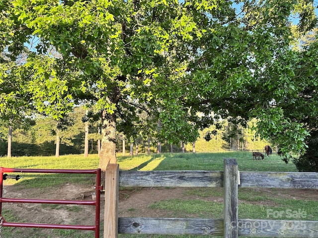 view of gate featuring fence