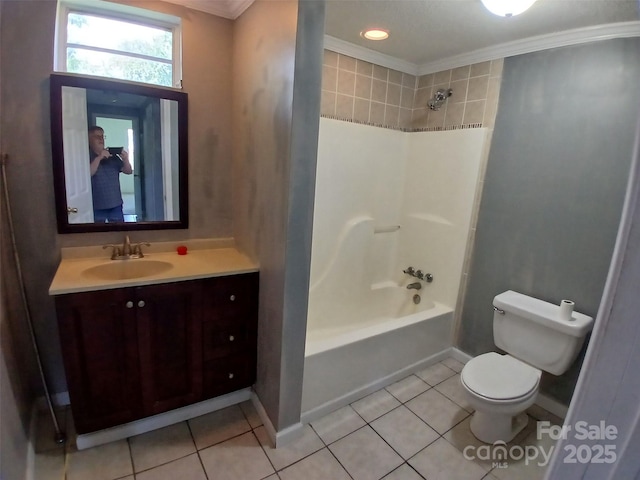 bathroom featuring tile patterned flooring, ornamental molding, vanity, toilet, and baseboards