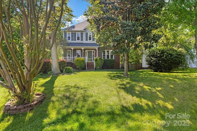 view of front of house featuring a porch and a front lawn