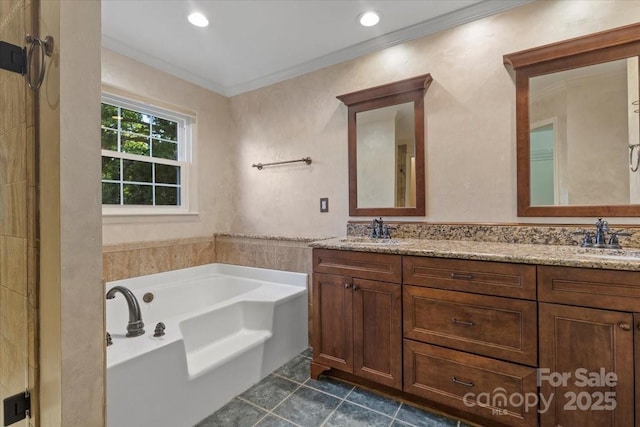 full bath with double vanity, crown molding, a bath, and a sink