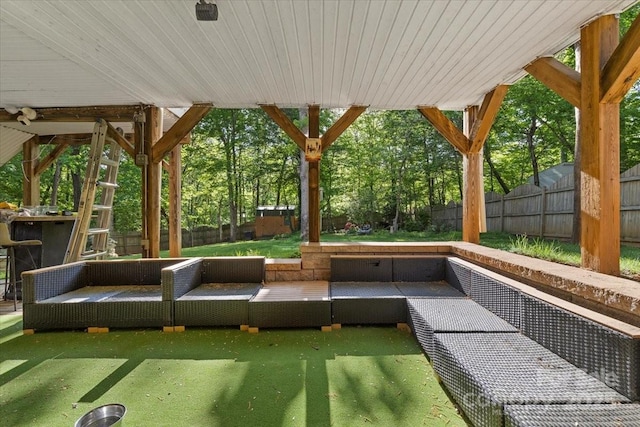 surrounding community featuring an outdoor living space and a fenced backyard