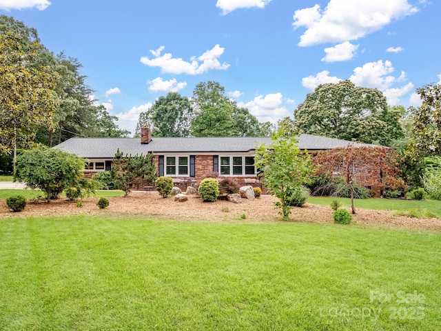 895 Furnace Rd, Iron Station, NC 28080 - view of front of home featuring a chimney, a front lawn, and a shingled roof
