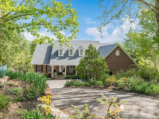 50 Hillcrest Dr, Weaverville, NC 28787 - cape cod-style house with brick siding and a shingled roof