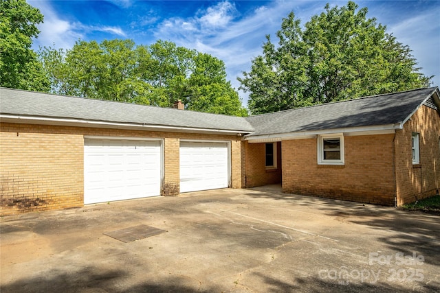 garage featuring driveway