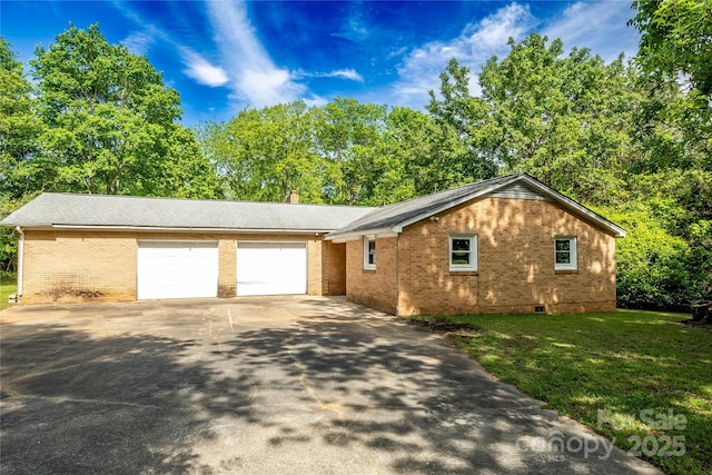 ranch-style home featuring brick siding, a garage, crawl space, a front yard, and concrete driveway