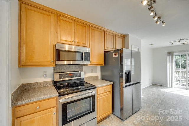 1835 Montague Rd, Clover, SC 29710 - kitchen with appliances with stainless steel finishes, rail lighting, light tile patterned flooring, and light countertops
