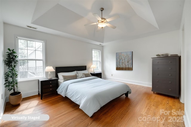 1835 Montague Rd, Clover, SC 29710 - bedroom with light wood finished floors, baseboards, and a raised ceiling