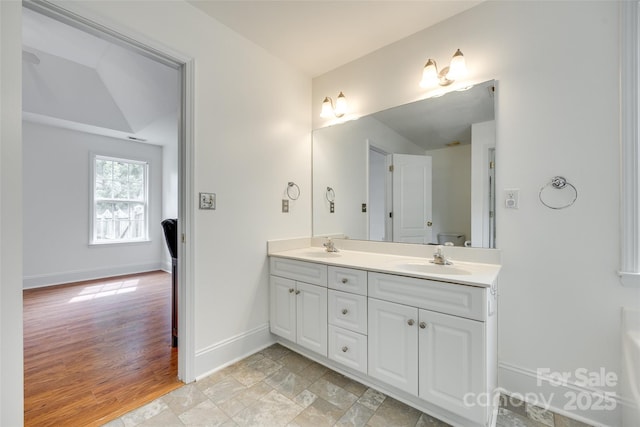 1835 Montague Rd, Clover, SC 29710 - full bath with double vanity, vaulted ceiling, and baseboards