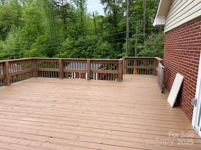 323 Hibriten Dr SE, Lenoir, NC 28645 - wooden terrace featuring a view of trees
