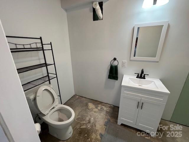 323 Hibriten Dr SE, Lenoir, NC 28645 - bathroom featuring toilet, concrete flooring, and vanity