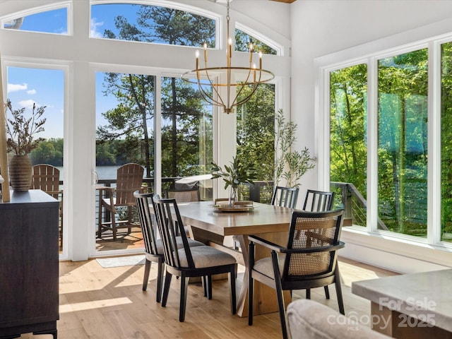 8044 Edgewater Dr Unit 100, Norwood, NC 28128 - sunroom / solarium featuring a chandelier