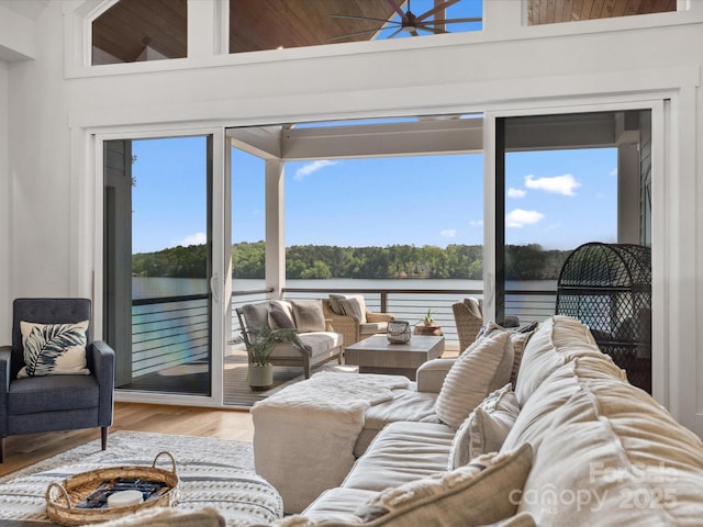 8044 Edgewater Dr Unit 100, Norwood, NC 28128 - living room featuring a water view, healthy amount of natural light, wood finished floors, and a high ceiling