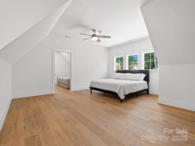8044 Edgewater Dr Unit 100, Norwood, NC 28128 - bedroom with light wood-type flooring, lofted ceiling, baseboards, and ceiling fan