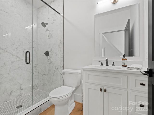 8044 Edgewater Dr Unit 100, Norwood, NC 28128 - full bathroom featuring toilet, vanity, a marble finish shower, and wood finished floors