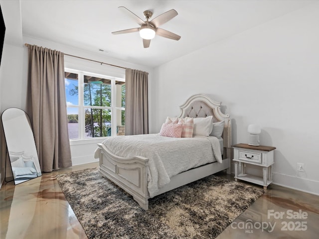 8044 Edgewater Dr Unit 100, Norwood, NC 28128 - bedroom featuring baseboards and a ceiling fan