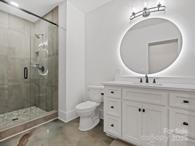 8044 Edgewater Dr Unit 100, Norwood, NC 28128 - bathroom with toilet, vanity, a stall shower, and baseboards