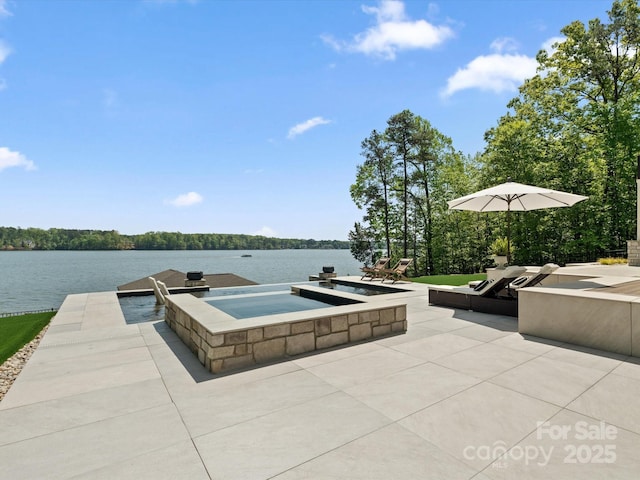 8044 Edgewater Dr Unit 100, Norwood, NC 28128 - view of patio / terrace with an in-ground hot tub and a water view