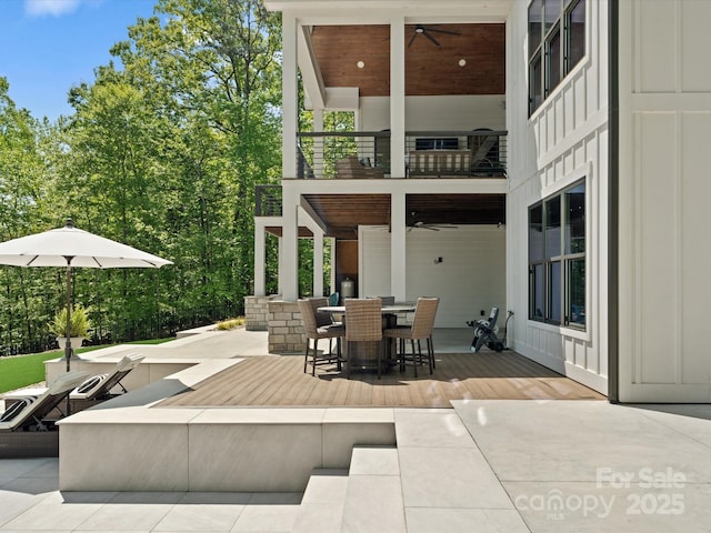 8044 Edgewater Dr Unit 100, Norwood, NC 28128 - view of patio / terrace with a balcony, a ceiling fan, and outdoor dining space