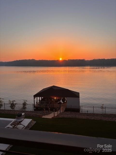 8044 Edgewater Dr Unit 100, Norwood, NC 28128 - dock with a water view, a gazebo, and a patio area