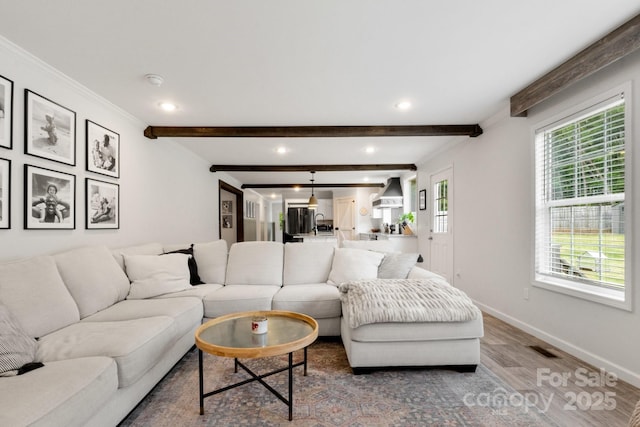 living room featuring beam ceiling, recessed lighting, baseboards, wood finished floors, and visible vents