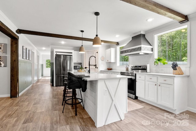 kitchen featuring backsplash, beam ceiling, custom range hood, light countertops, and stainless steel appliances
