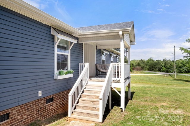 deck with a lawn and a porch