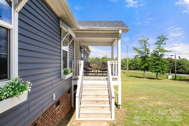 exterior space featuring a lawn and stairs