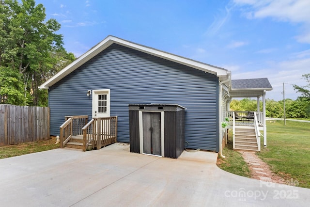 exterior space with a lawn, fence, and a patio area