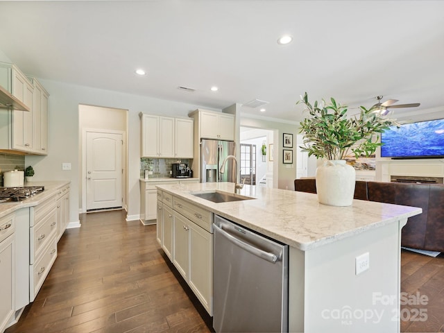 5420 Meadowcroft Way, Fort Mill, SC 29708 - kitchen featuring appliances with stainless steel finishes, a sink, a kitchen island with sink, ceiling fan, and decorative backsplash