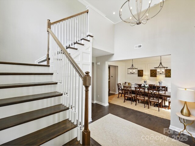 5420 Meadowcroft Way, Fort Mill, SC 29708 - staircase with a chandelier, baseboards, wood finished floors, crown molding, and a high ceiling