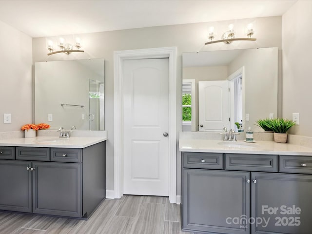 5420 Meadowcroft Way, Fort Mill, SC 29708 - bathroom featuring two vanities and a chandelier