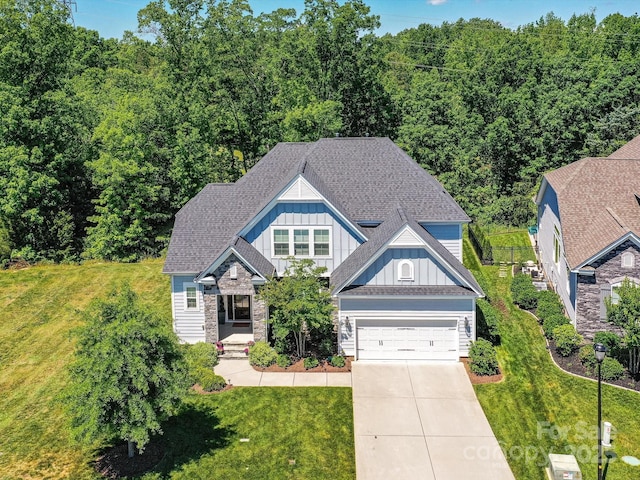 5420 Meadowcroft Way, Fort Mill, SC 29708 - view of front of property with board and batten siding, driveway, a front yard, and stone siding