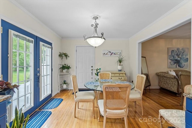 324 Autumn Dr, Harrisburg, NC 28075 - dining area featuring crown molding, french doors, and light wood finished floors