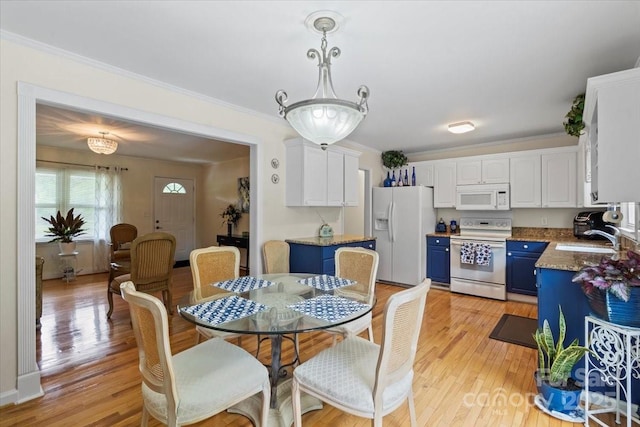 324 Autumn Dr, Harrisburg, NC 28075 - dining space featuring light wood-type flooring and ornamental molding