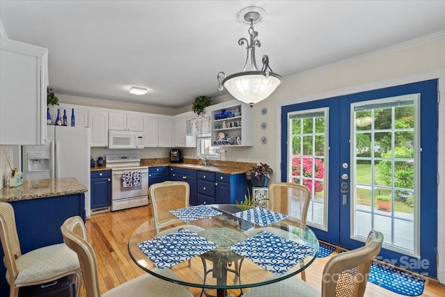 324 Autumn Dr, Harrisburg, NC 28075 - kitchen with blue cabinetry, white appliances, and french doors