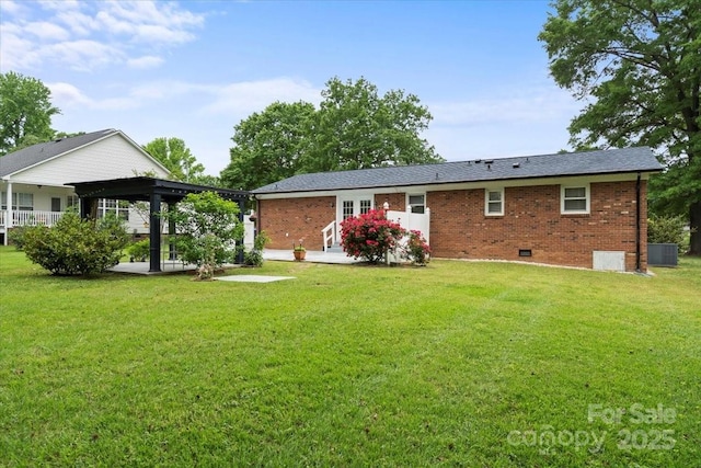 324 Autumn Dr, Harrisburg, NC 28075 - rear view of house with brick siding, central air condition unit, a yard, and crawl space