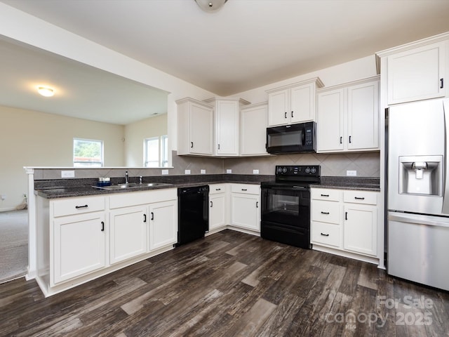 kitchen featuring dark wood-style floors, black appliances, white cabinetry, and a sink