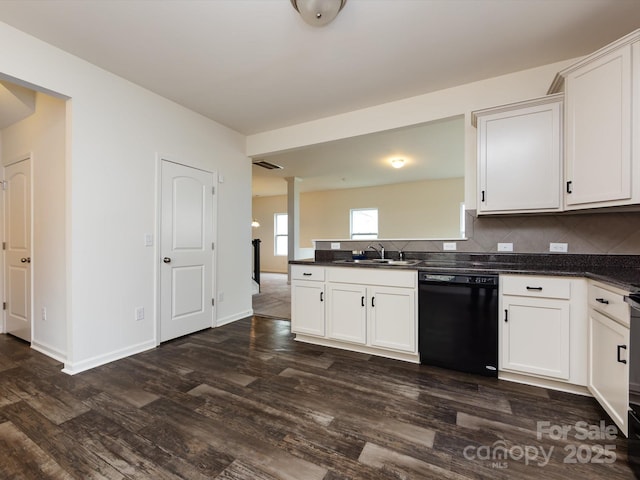 kitchen with backsplash, dark wood-style flooring, dishwasher, and a sink