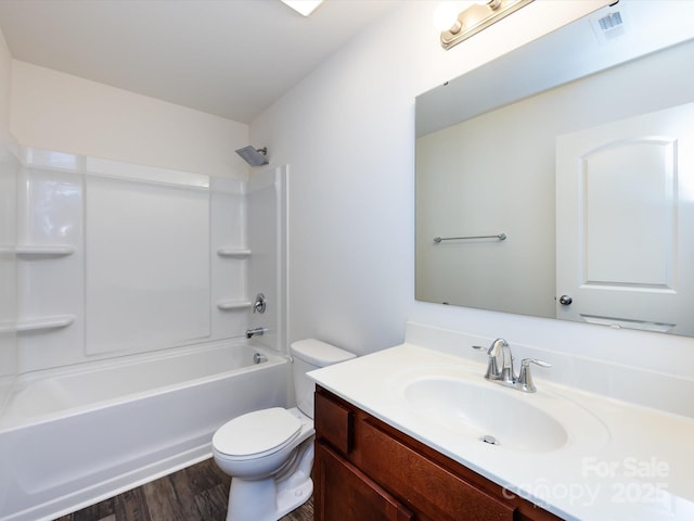 full bathroom featuring shower / tub combination, visible vents, toilet, wood finished floors, and vanity