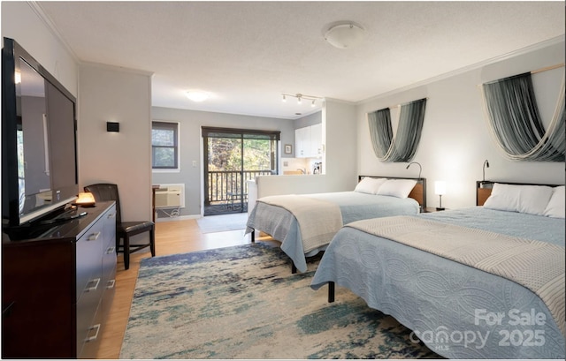 160 Whitney Blvd, Lake Lure, NC 28746 - bedroom with access to outside, ornamental molding, baseboards, and light wood-type flooring