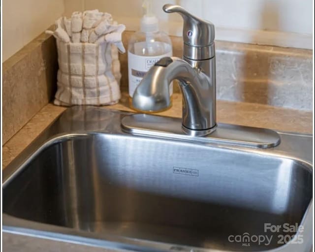 160 Whitney Blvd, Lake Lure, NC 28746 - details with a sink and decorative backsplash