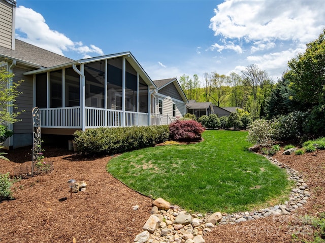 view of yard featuring a sunroom