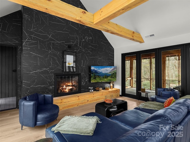 80 Hemlock Cir, Black Mountain, NC 28711 - living room with a premium fireplace, wood finished floors, french doors, and an accent wall