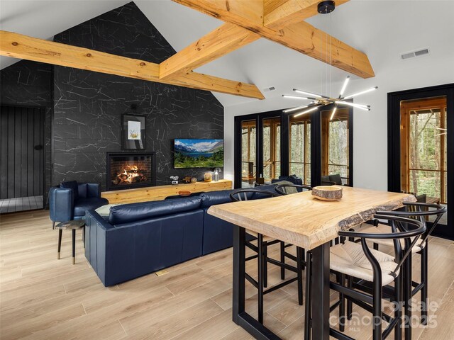 80 Hemlock Cir, Black Mountain, NC 28711 - interior space featuring an accent wall, a high end fireplace, and light wood-style floors