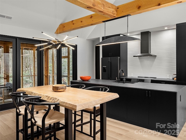 80 Hemlock Cir, Black Mountain, NC 28711 - kitchen featuring high end refrigerator, dark cabinets, a sink, and wall chimney range hood