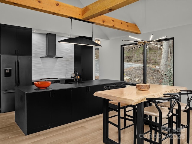 80 Hemlock Cir, Black Mountain, NC 28711 - kitchen featuring high end refrigerator, wall chimney exhaust hood, dark cabinets, a sink, and dark countertops