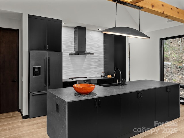 80 Hemlock Cir, Black Mountain, NC 28711 - kitchen with dark cabinetry, fridge with ice dispenser, wall chimney range hood, and a sink